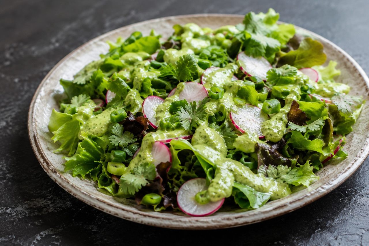 no-cook radish and greens salad with a blended avocado-citrus dressing