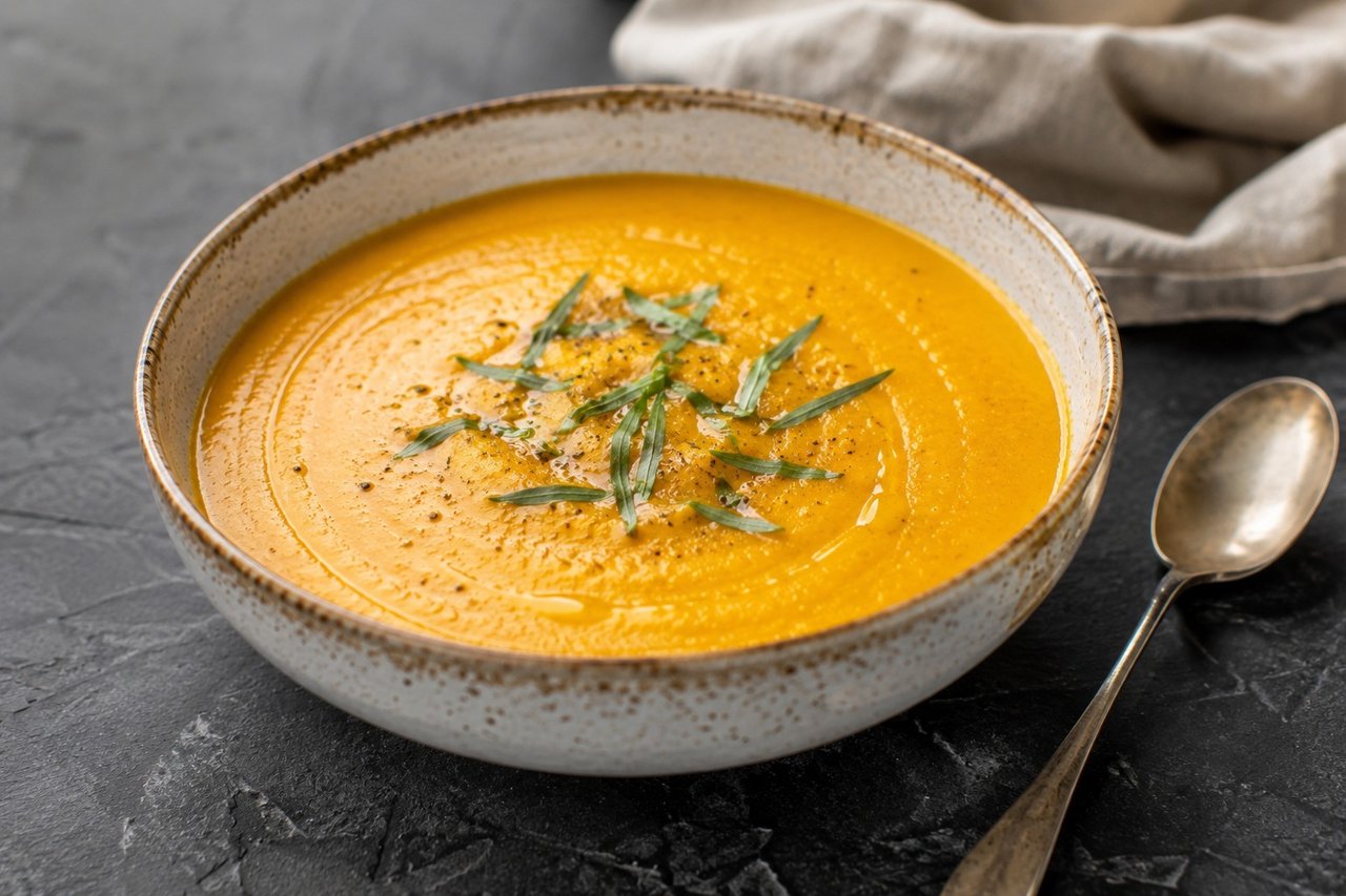 blended butternut squash soup on a bone broth and coconut milk base, brightened with lemon and fresh tarragon