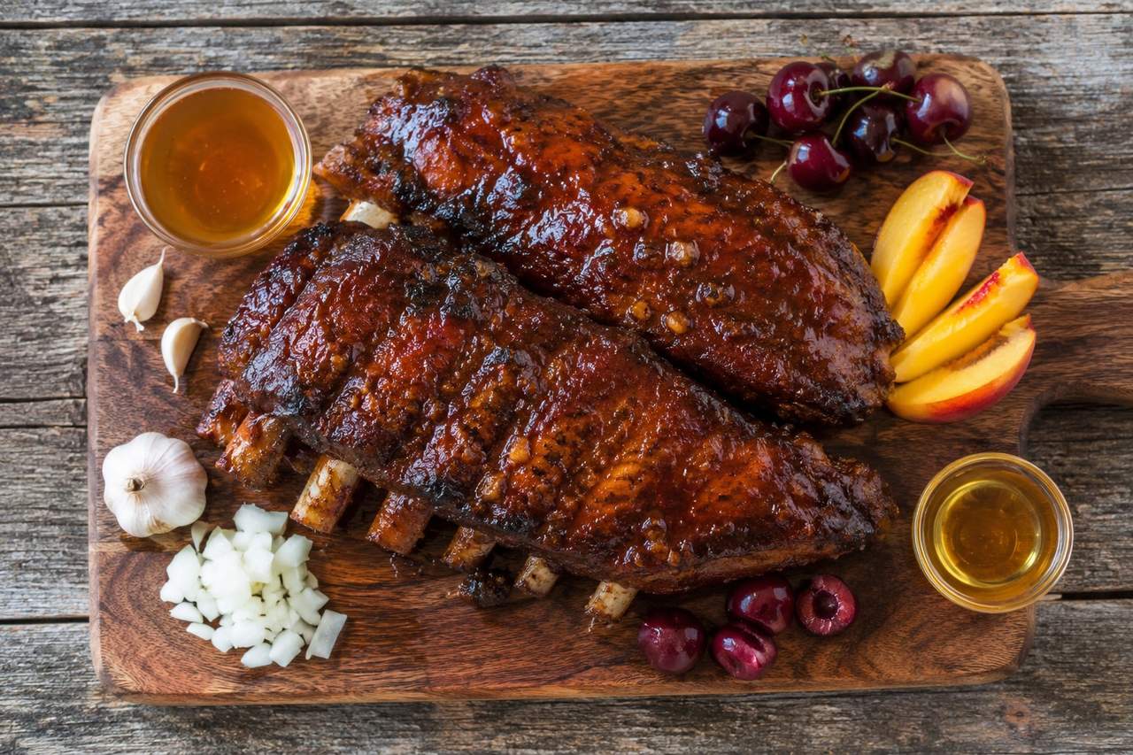 pork spare ribs pressure-cooked and glazed with a stone-fruit BBQ sauce made from peaches and cherries